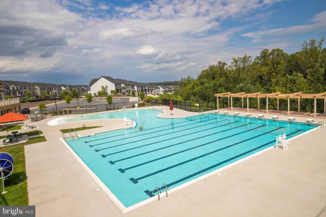 a view of a swimming pool with a patio