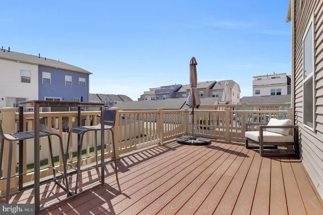 a view of a balcony with wooden floor
