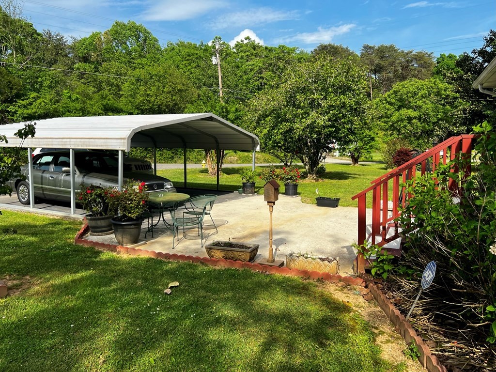 106 Pin Hook Road Spring City, TN 37381 - Photo 7 of 37 a view of a chair and table under an umbrella