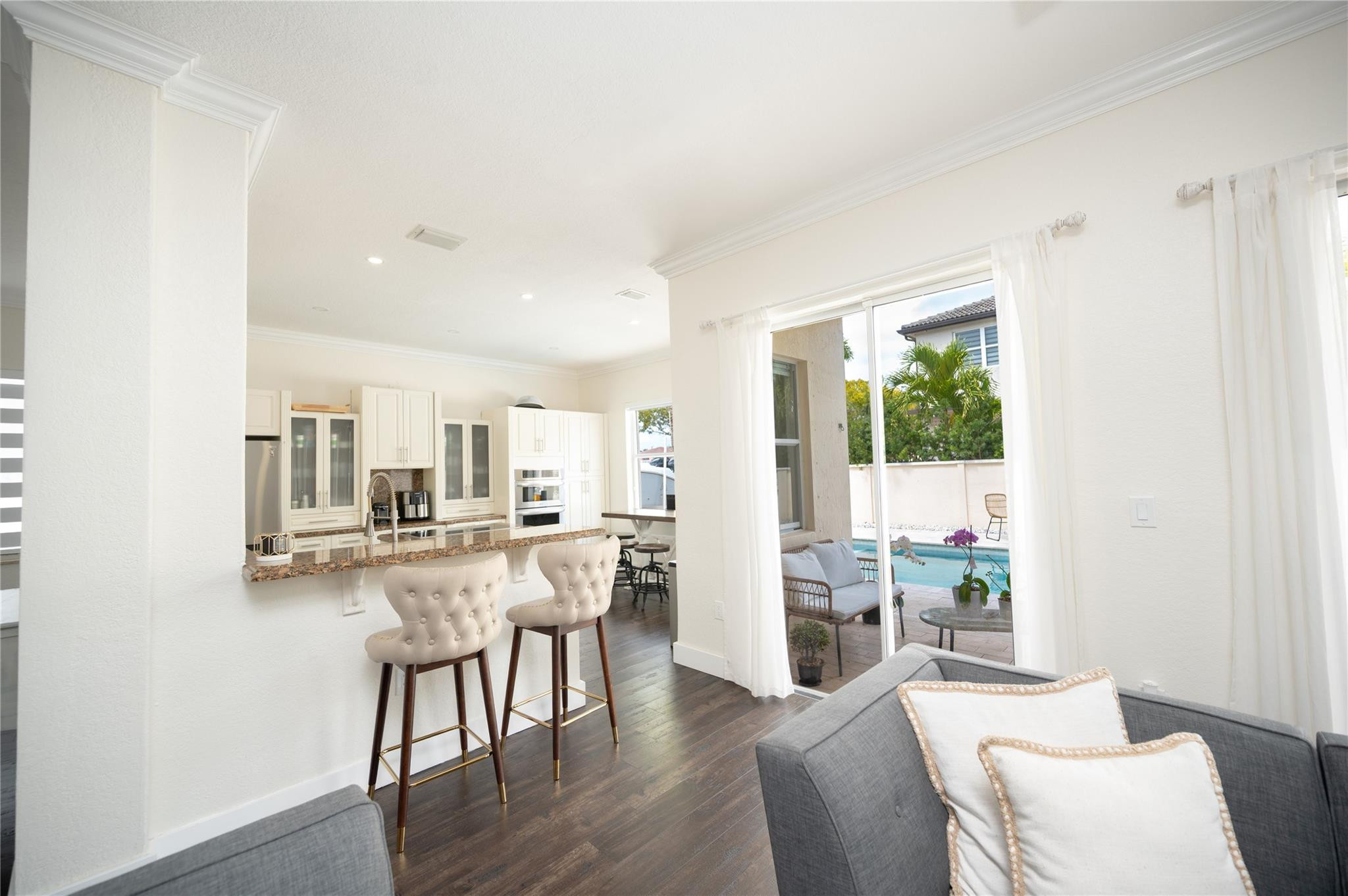 8891 Northwest 178th Lane Hialeah, FL 33018 - Photo 11 of 42 a dining room with furniture and wooden floor