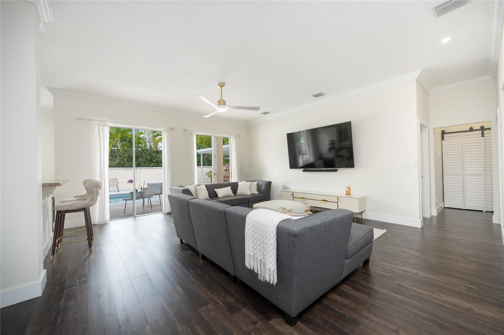 8891 Northwest 178th Lane Hialeah, FL 33018 - Photo 13 of 42 a living room with furniture and a flat screen tv