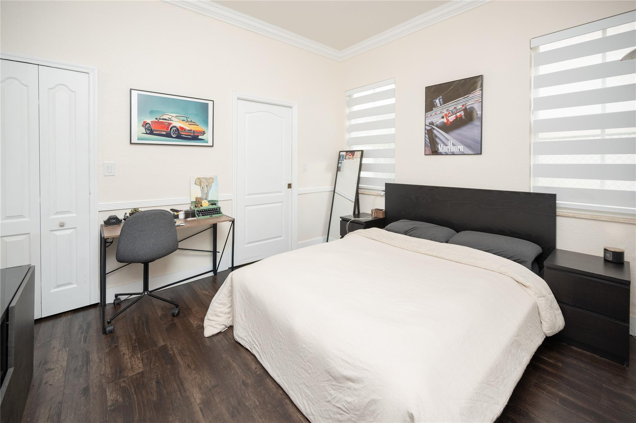 8891 Northwest 178th Lane Hialeah, FL 33018 - Photo 16 of 42 a bedroom with bed and a painting on the wall