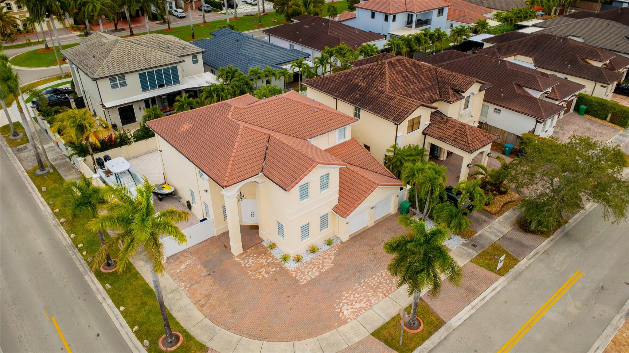 8891 Northwest 178th Lane Hialeah, FL 33018 - Photo 2 of 42 an aerial view of residential houses with outdoor space and parking