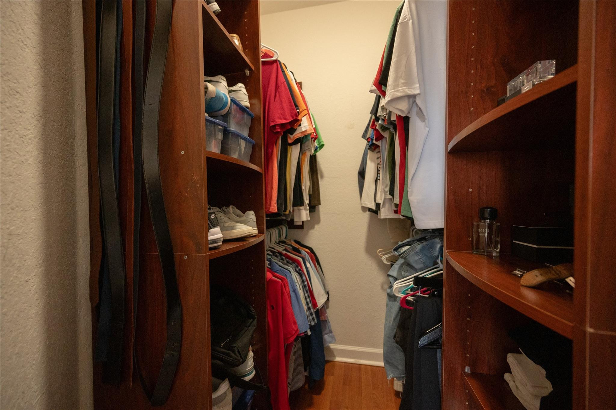 8891 Northwest 178th Lane Hialeah, FL 33018 - Photo 27 of 42 a view of walk in closet with clothes and shoes