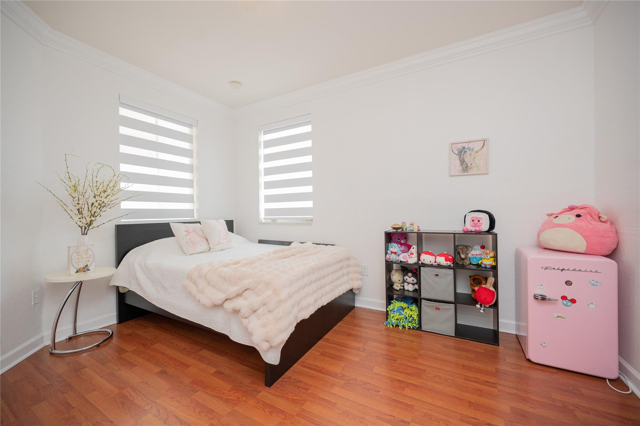 8891 Northwest 178th Lane Hialeah, FL 33018 - Photo 29 of 42 a bedroom with a bed and a wooden floor