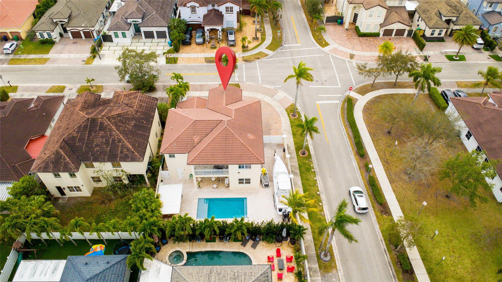 8891 Northwest 178th Lane Hialeah, FL 33018 - Photo 3 of 42 an aerial view of residential house with pool and lawn chairs