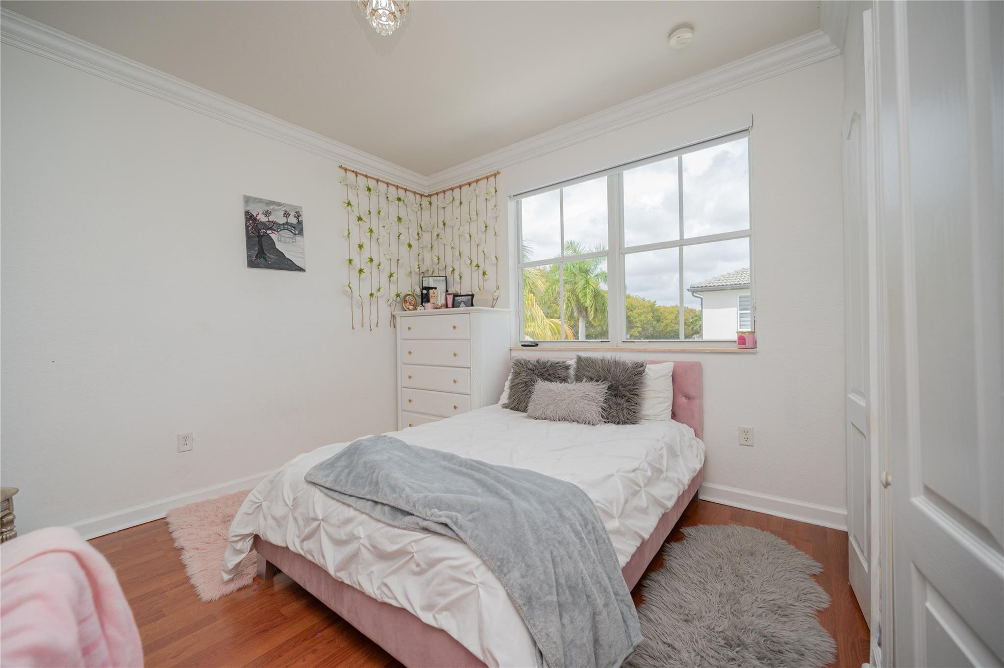 8891 Northwest 178th Lane Hialeah, FL 33018 - Photo 31 of 42 a bedroom with a bed and a window