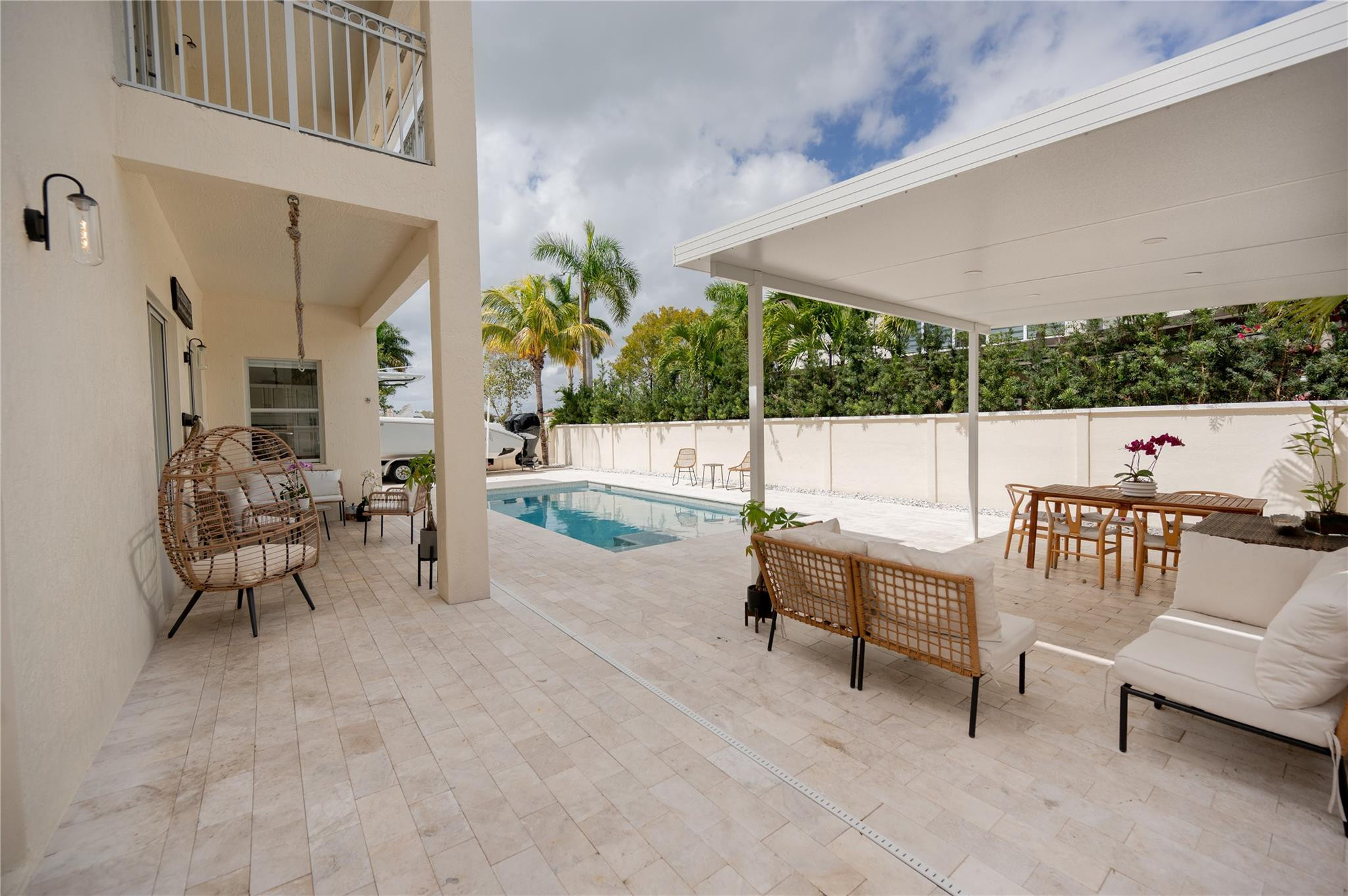 8891 Northwest 178th Lane Hialeah, FL 33018 - Photo 35 of 42 a building outdoor space with patio furniture and potted plants