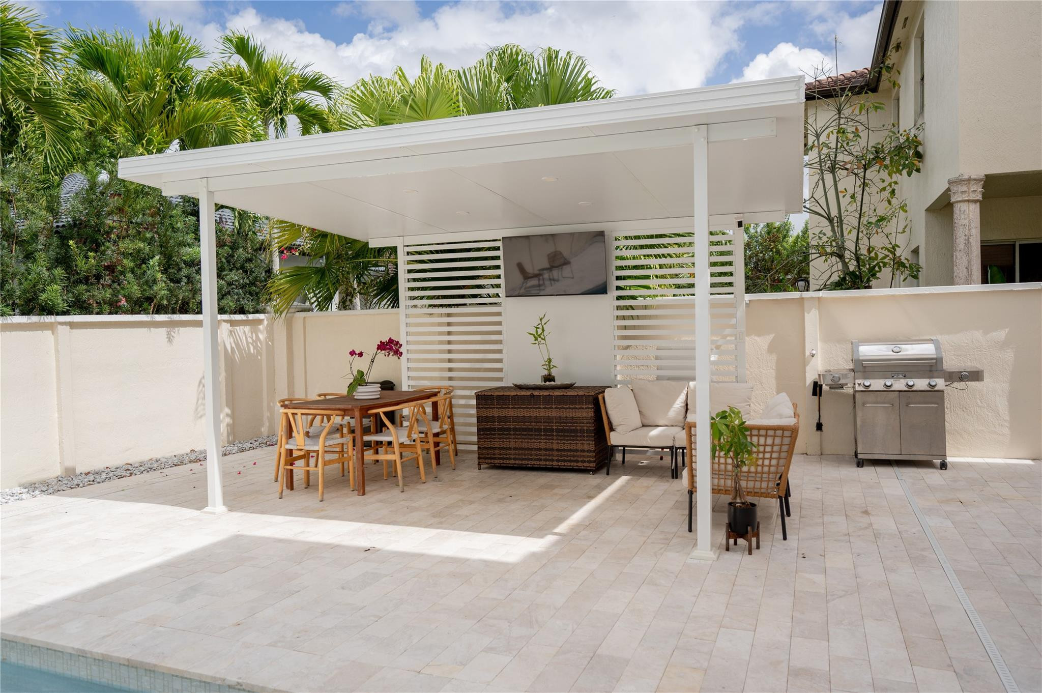8891 Northwest 178th Lane Hialeah, FL 33018 - Photo 36 of 42 a backyard of a house with table and chairs