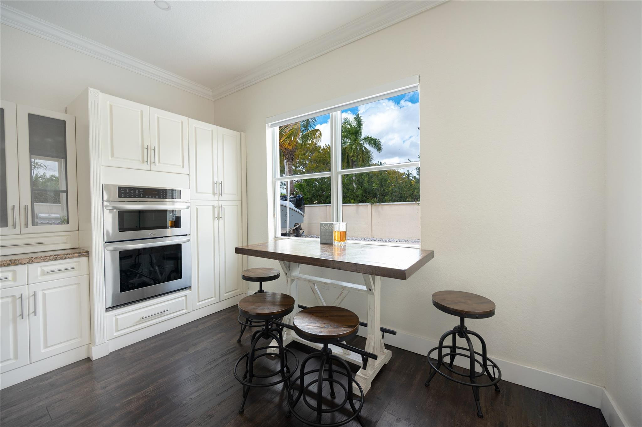 8891 Northwest 178th Lane Hialeah, FL 33018 - Photo 10 of 42 a view of a workspace with furniture and a window