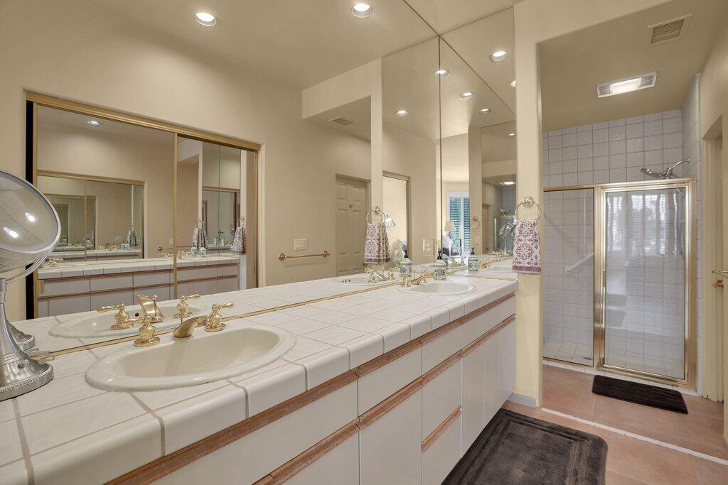 9 Lakeshore Drive Rancho Mirage, CA 92270 - Photo 11 of 41 a bathroom with a sink double vanity and a mirror