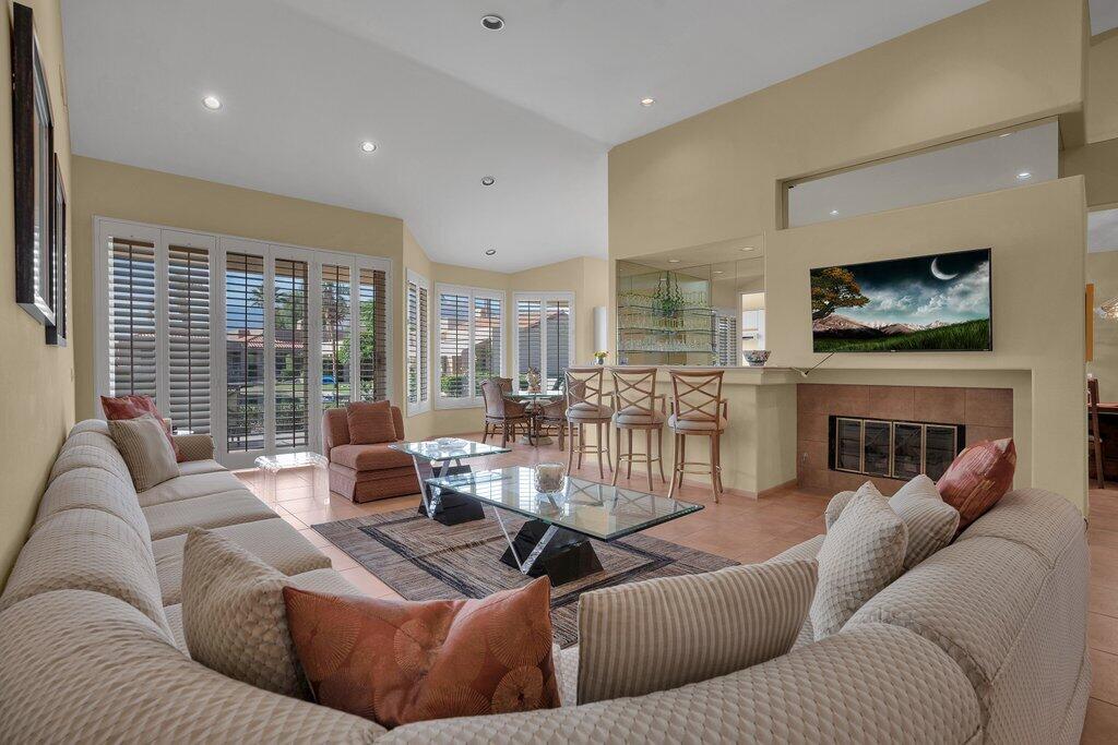 9 Lakeshore Drive Rancho Mirage, CA 92270 - Photo 18 of 41 a living room with fireplace furniture and a flat screen tv