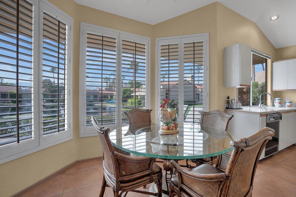9 Lakeshore Drive Rancho Mirage, CA 92270 - Photo 21 of 41 a view of a dining room with furniture and window