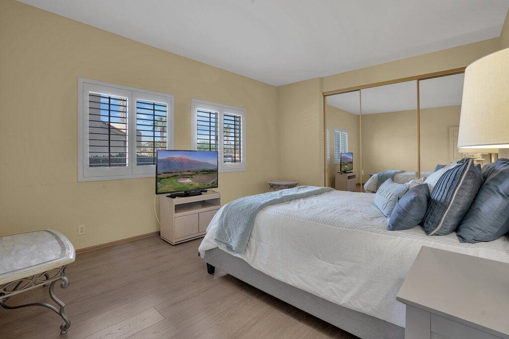 9 Lakeshore Drive Rancho Mirage, CA 92270 - Photo 25 of 41 a bedroom with a bed and a desk