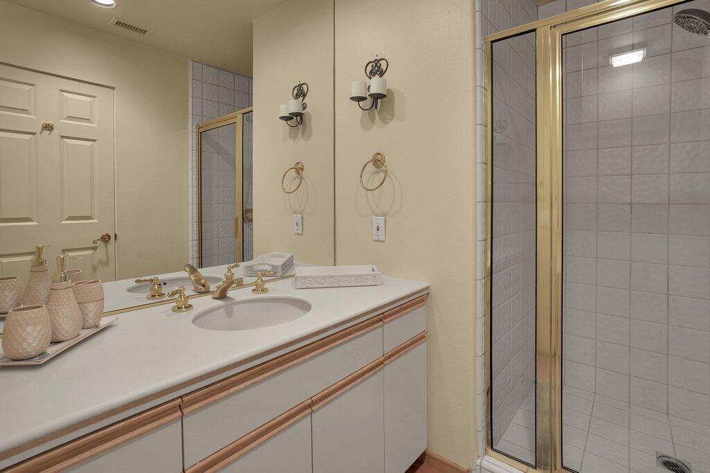 9 Lakeshore Drive Rancho Mirage, CA 92270 - Photo 26 of 41 a bathroom with a sink and a mirror