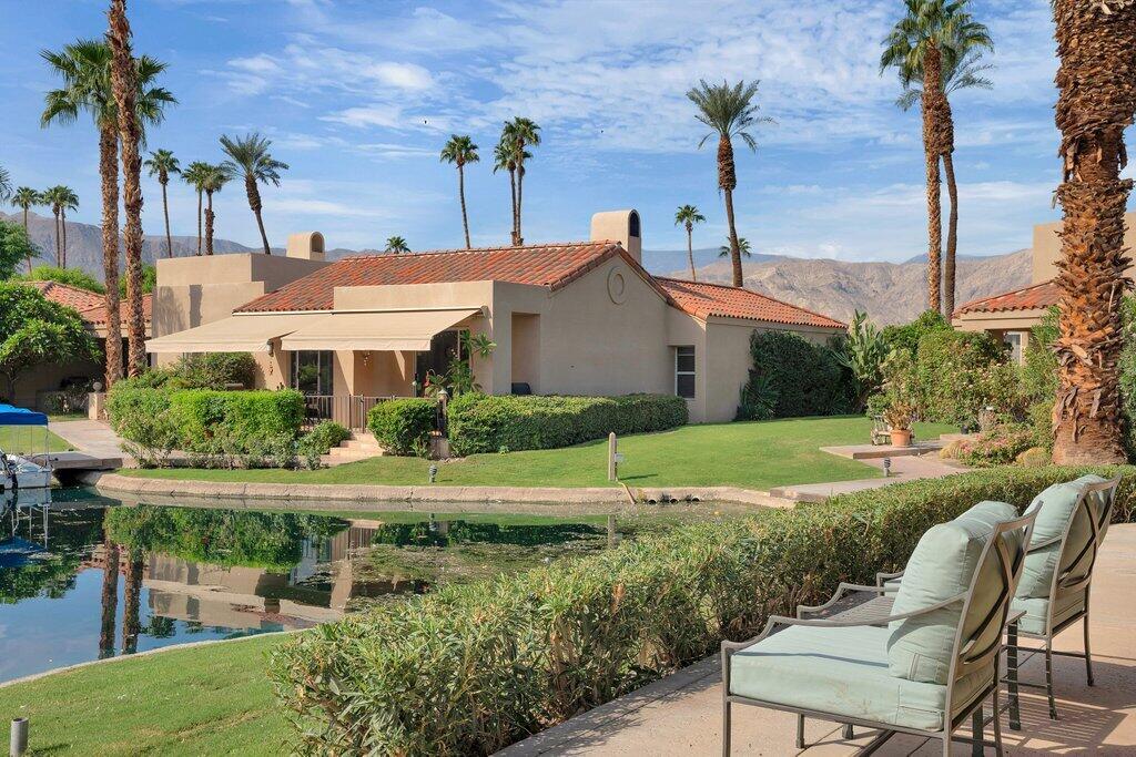 9 Lakeshore Drive Rancho Mirage, CA 92270 - Photo 27 of 41 a front view of a house with garden