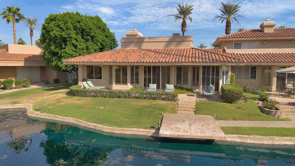 9 Lakeshore Drive Rancho Mirage, CA 92270 - Photo 28 of 41 a front view of a house with garden
