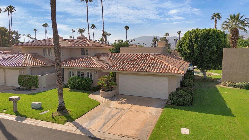 9 Lakeshore Drive Rancho Mirage, CA 92270 - Photo 31 of 41 a view of a house with a backyard