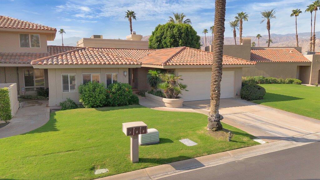 9 Lakeshore Drive Rancho Mirage, CA 92270 - Photo 32 of 41 a front view of a house with garden