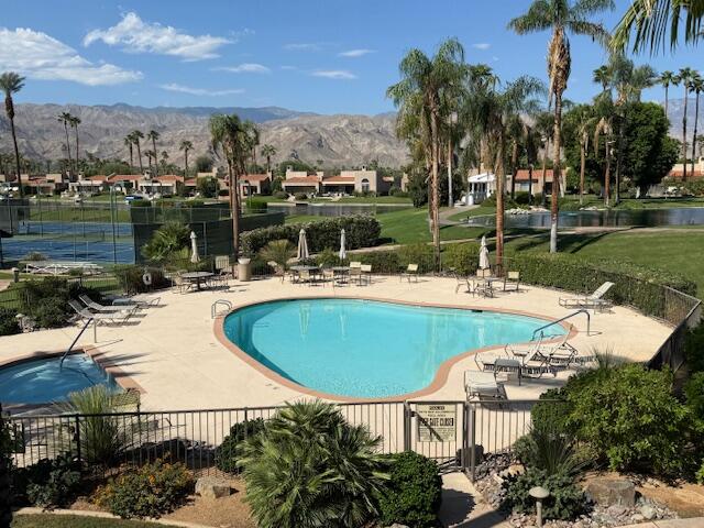 9 Lakeshore Drive Rancho Mirage, CA 92270 - Photo 40 of 41 a view of a swimming pool and lounge chairs