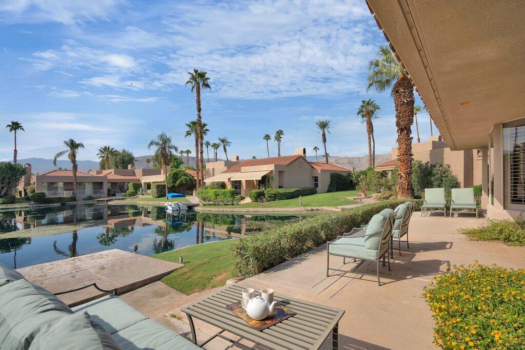 9 Lakeshore Drive Rancho Mirage, CA 92270 - Photo 4 of 41 a view of a patio with couches table and chairs and potted plants