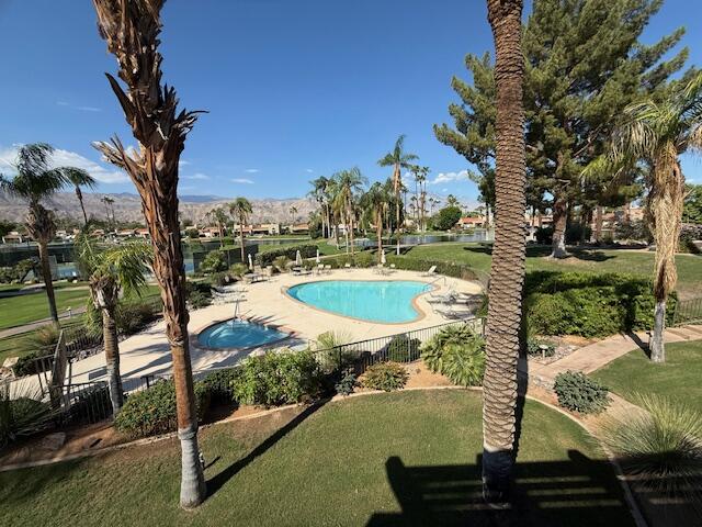 9 Lakeshore Drive Rancho Mirage, CA 92270 - Photo 6 of 41 a view of a swimming pool with a patio