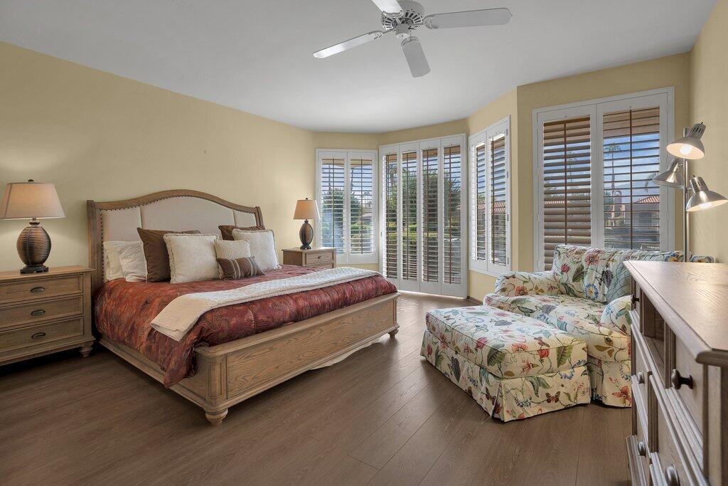 9 Lakeshore Drive Rancho Mirage, CA 92270 - Photo 9 of 41 a bedroom with a bed and large window