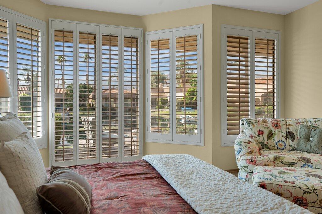 9 Lakeshore Drive Rancho Mirage, CA 92270 - Photo 10 of 41 a bedroom with furniture and a large window
