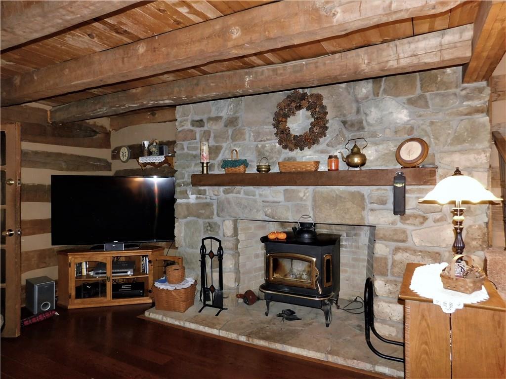 1010 Urich Road Smithton, PA 15479 - Photo 4 of 23 THE FIREPLACE IS CONSTRUCTED OF HAND CUT STONE AND HAS AN INSERT FOR ADDED EFFICIENCY....COZY UP THIS WINTER AND ENJOY!