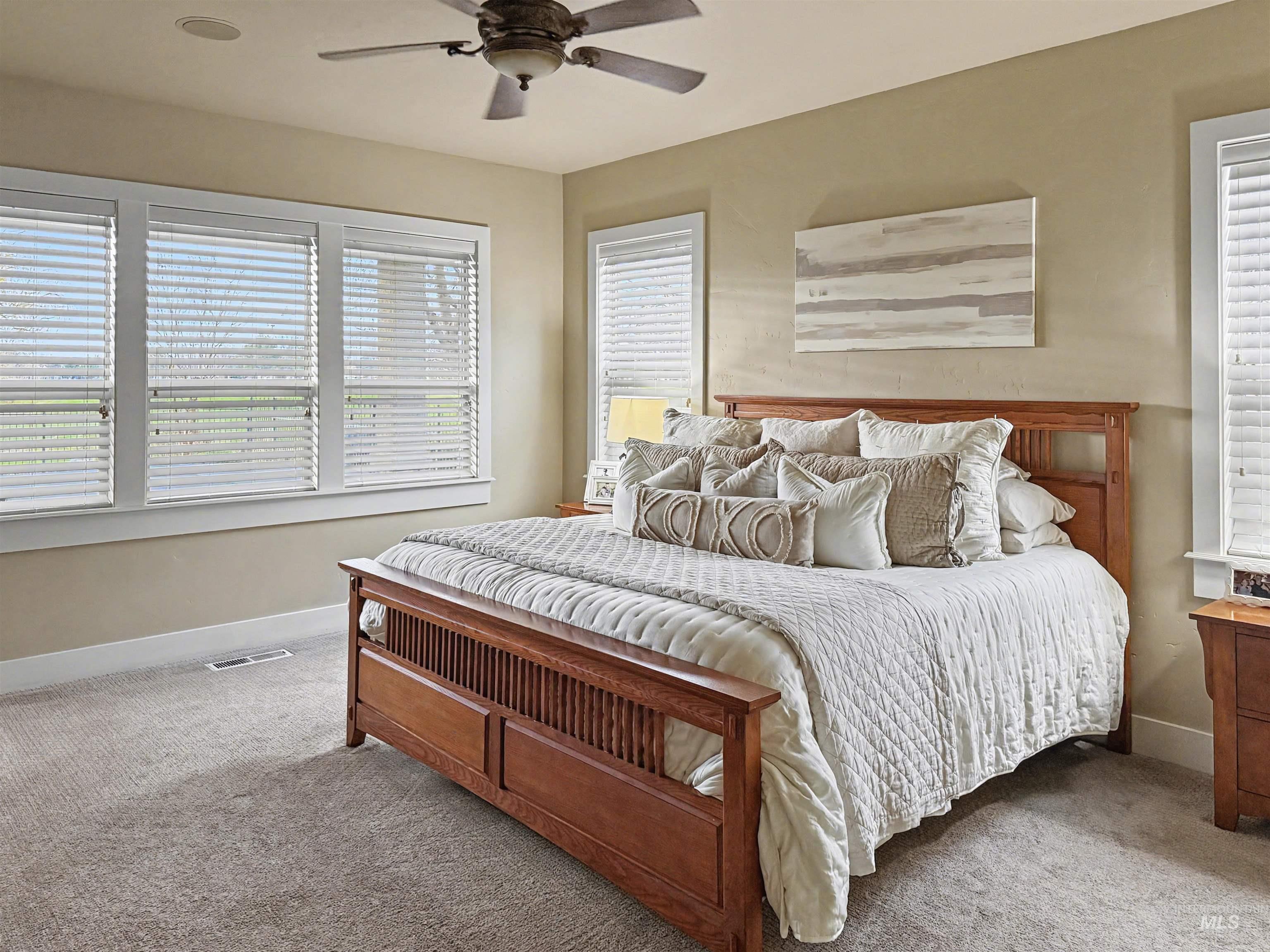 2425 South Chipper Way Eagle, ID 83616 - Photo 17 of 43 Carpeted bedroom featuring baseboards and ceiling fan