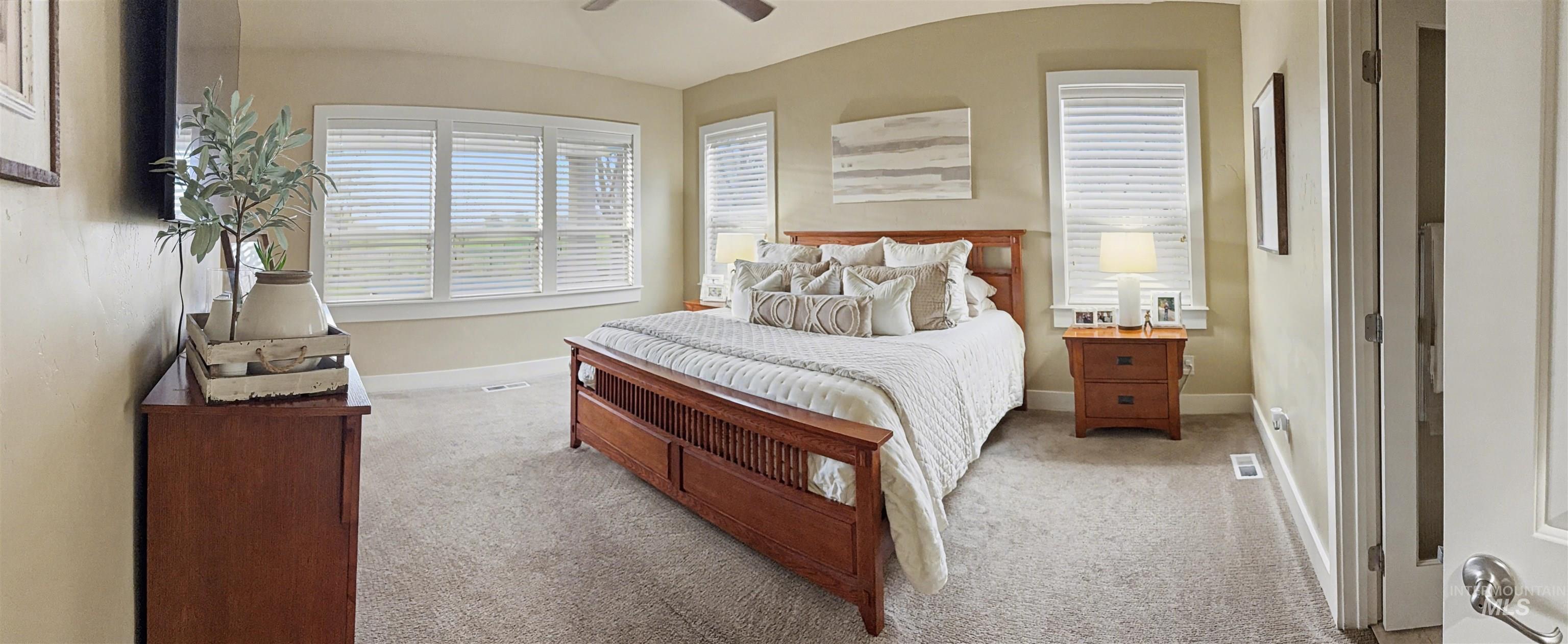 2425 South Chipper Way Eagle, ID 83616 - Photo 18 of 43 Bedroom featuring light colored carpet, a ceiling fan, and lofted ceiling