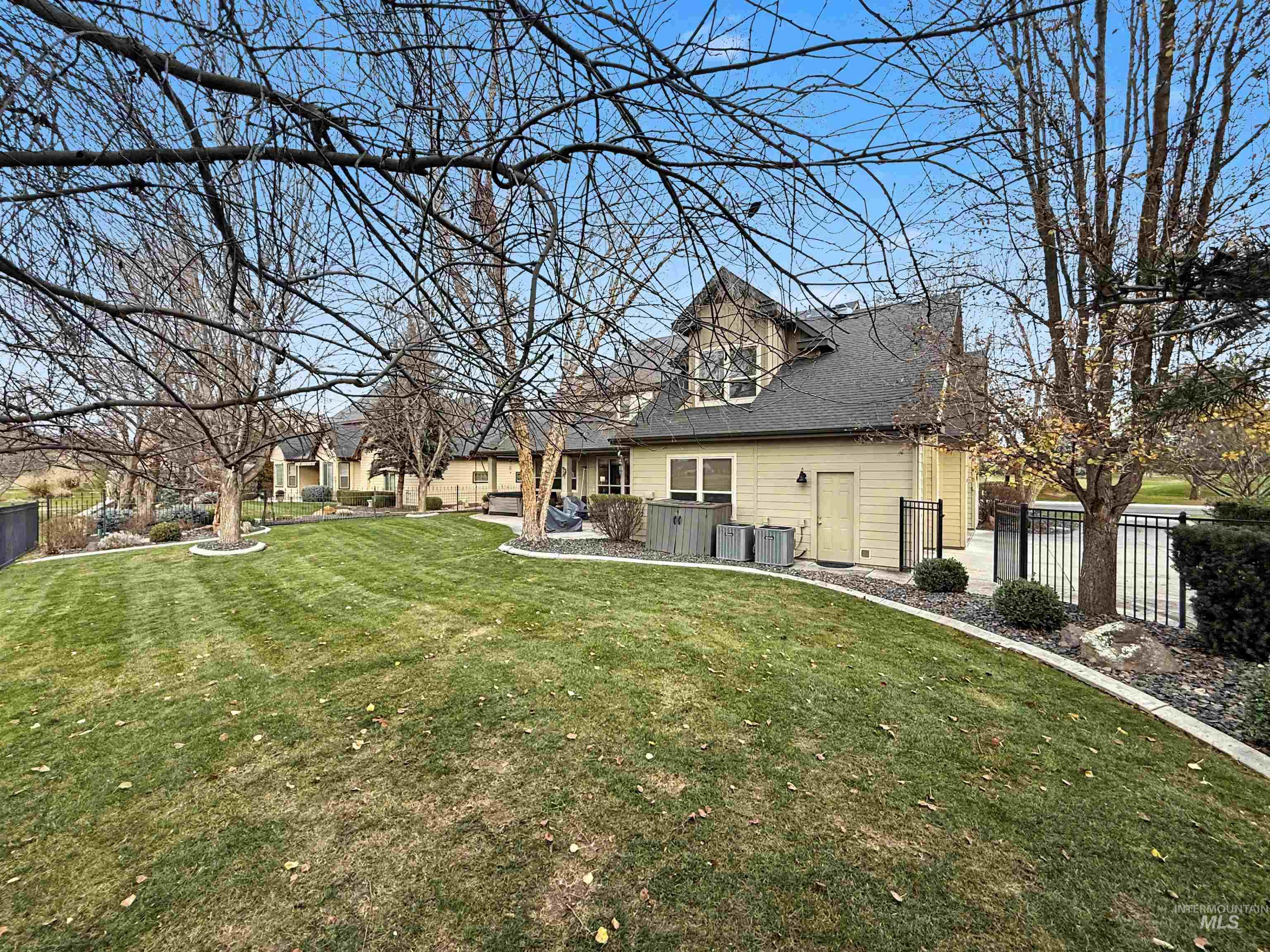 2425 South Chipper Way Eagle, ID 83616 - Photo 3 of 43 Rear view of house with roof with shingles