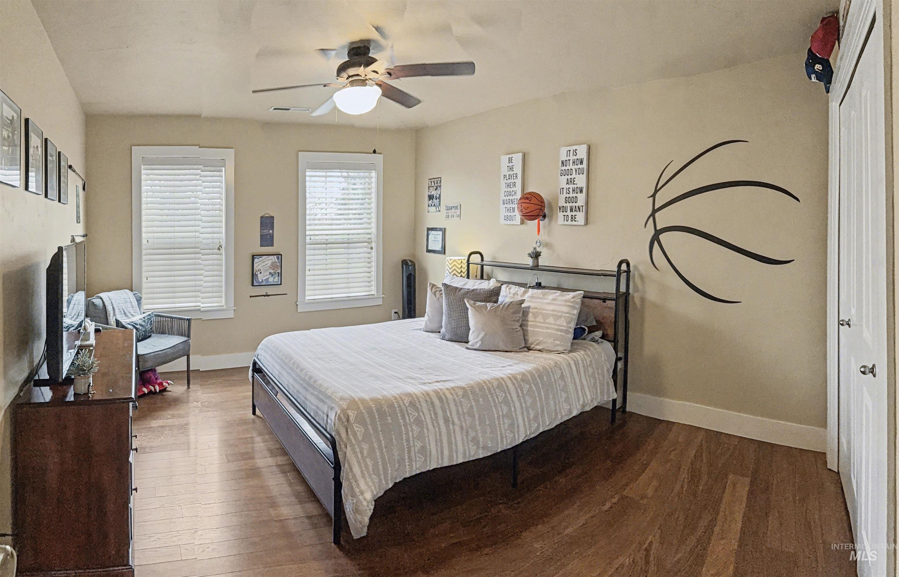 2425 South Chipper Way Eagle, ID 83616 - Photo 32 of 43 Bedroom with wood finished floors and ceiling fan
