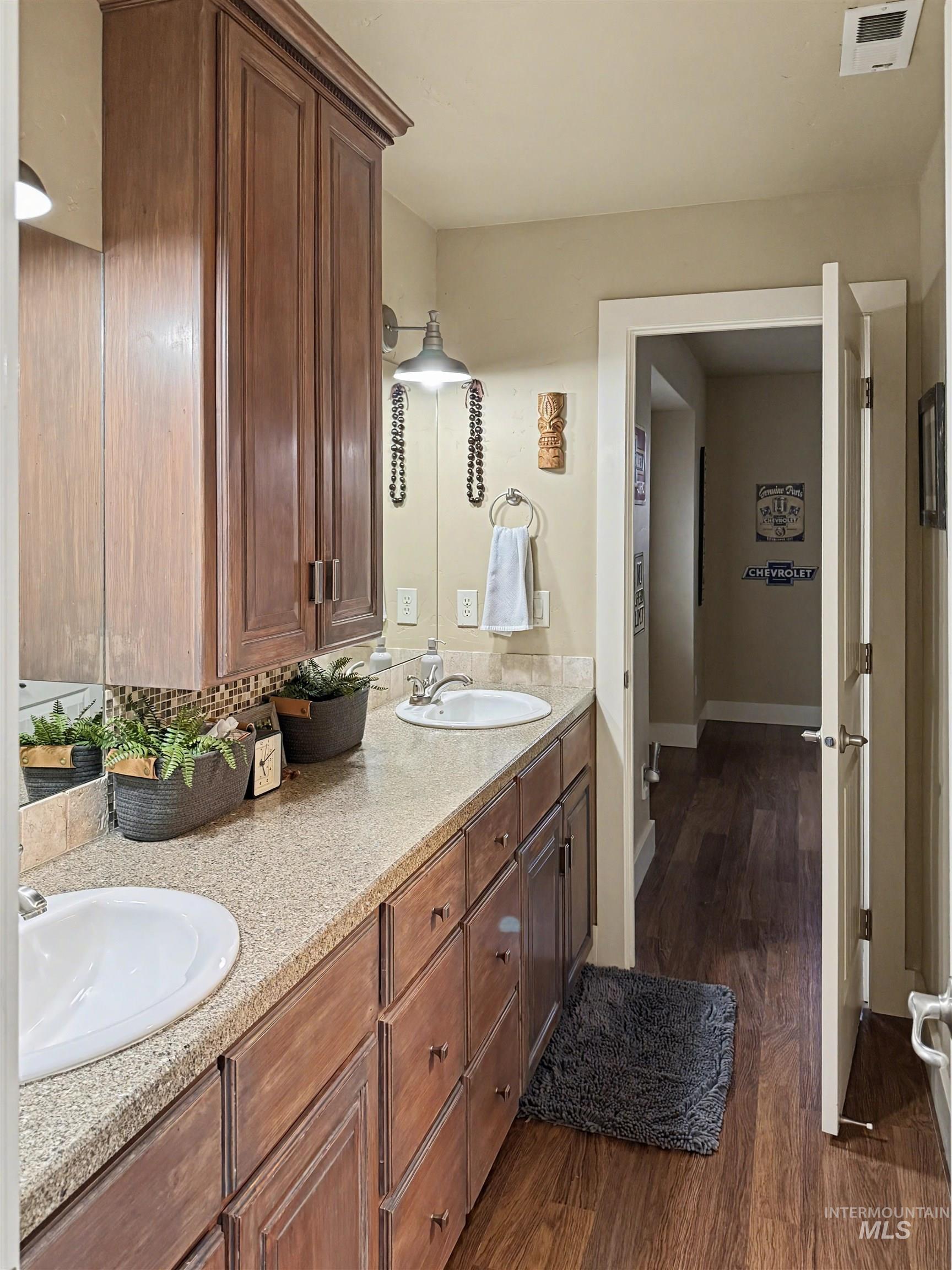 2425 South Chipper Way Eagle, ID 83616 - Photo 34 of 43 Bathroom featuring dark wood-style floors and double vanity