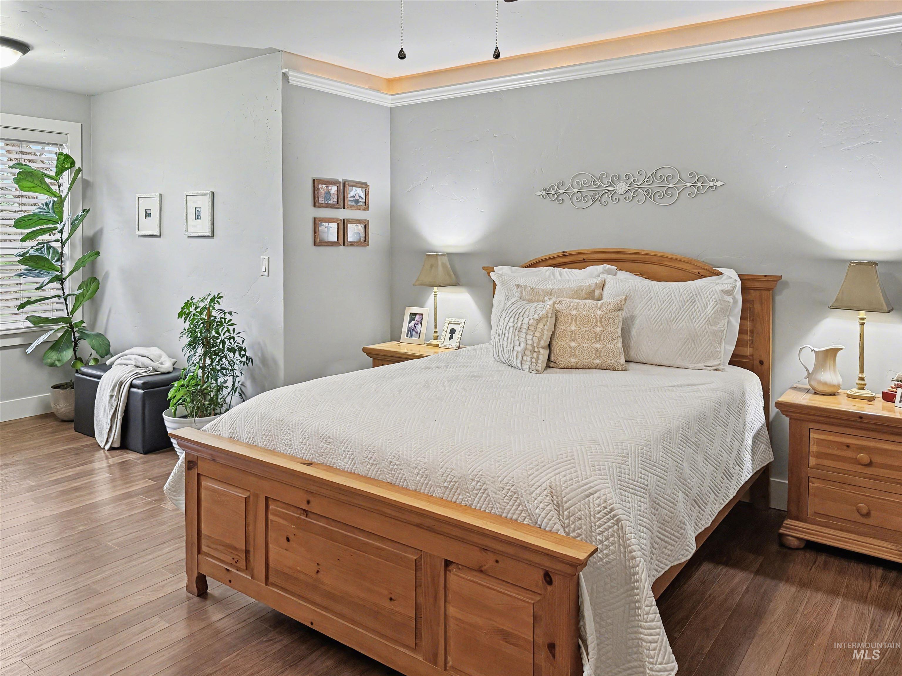 2425 South Chipper Way Eagle, ID 83616 - Photo 36 of 43 Bedroom with dark wood-style flooring