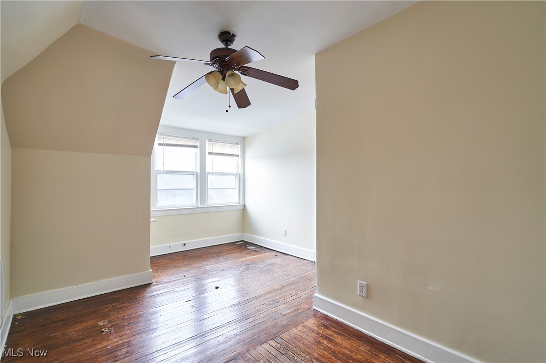 2152 Middlefield Road Cleveland, OH 44106 - Photo 21 of 50 Additional living space with ceiling fan, dark hardwood / wood-style flooring, and vaulted ceiling