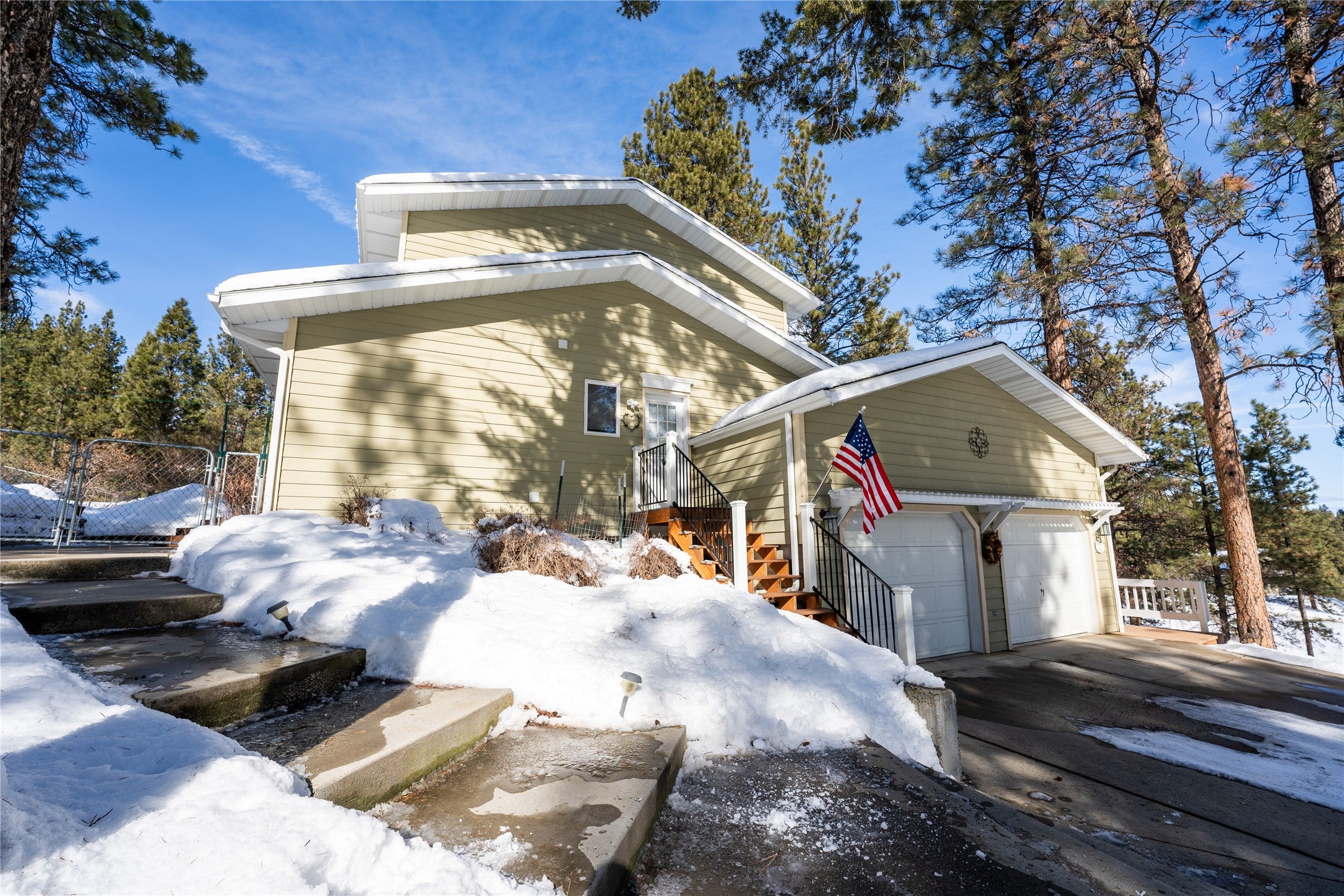 6 Pine Ridge Circle Clancy, MT 59634 - Photo 1 of 1 Snow covered property with a garage and fence