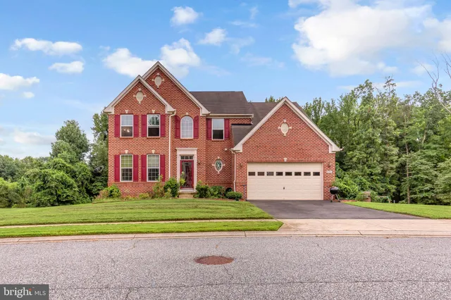 a front view of building with yard