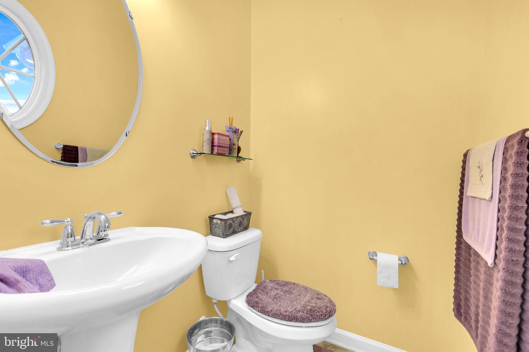 906 Gladway Road Baltimore, MD 21220 - Photo 13 of 52 a bathroom with a sink and a toilet