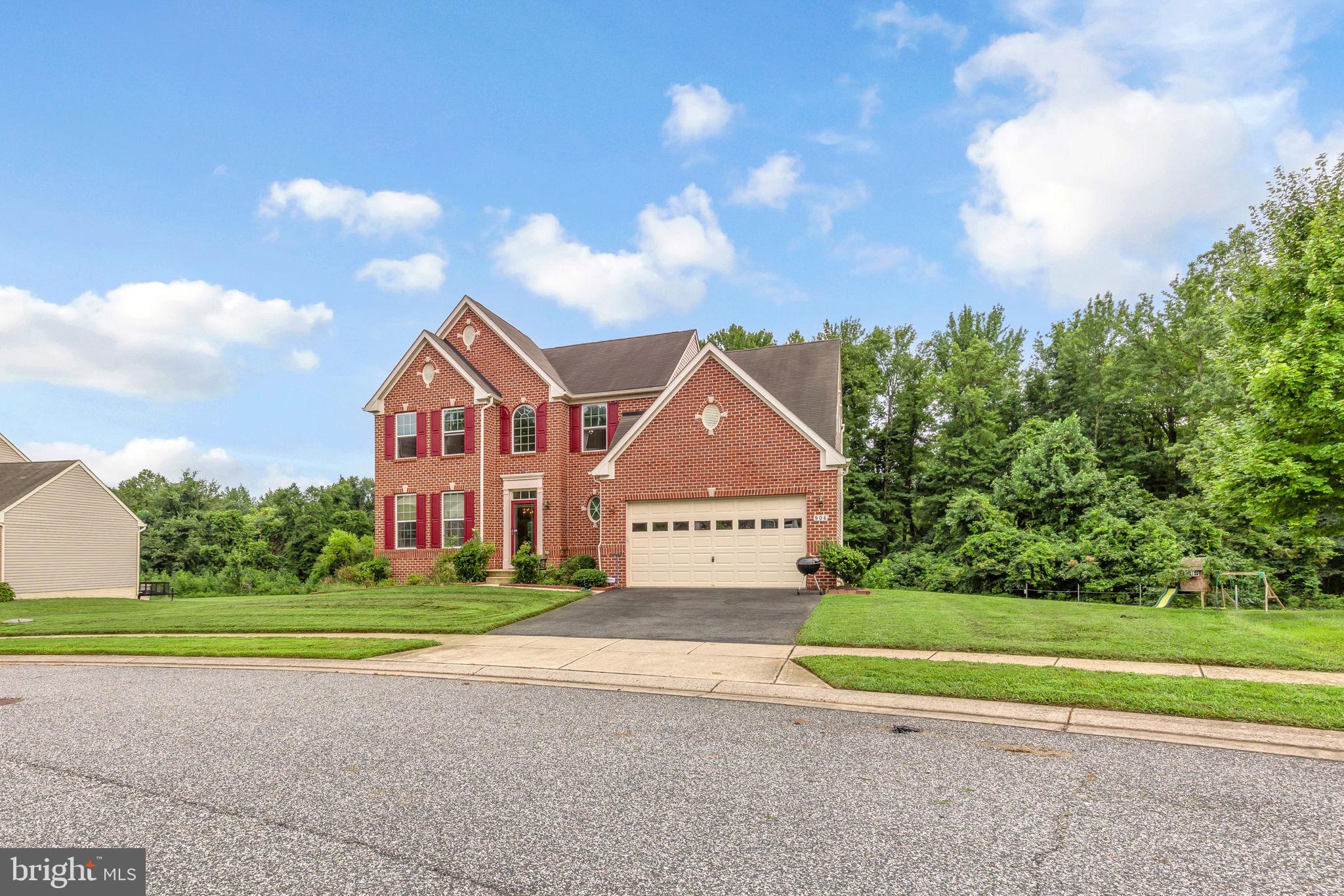 906 Gladway Road Baltimore, MD 21220 - Photo 2 of 52 a front view of a house with a yard and garage