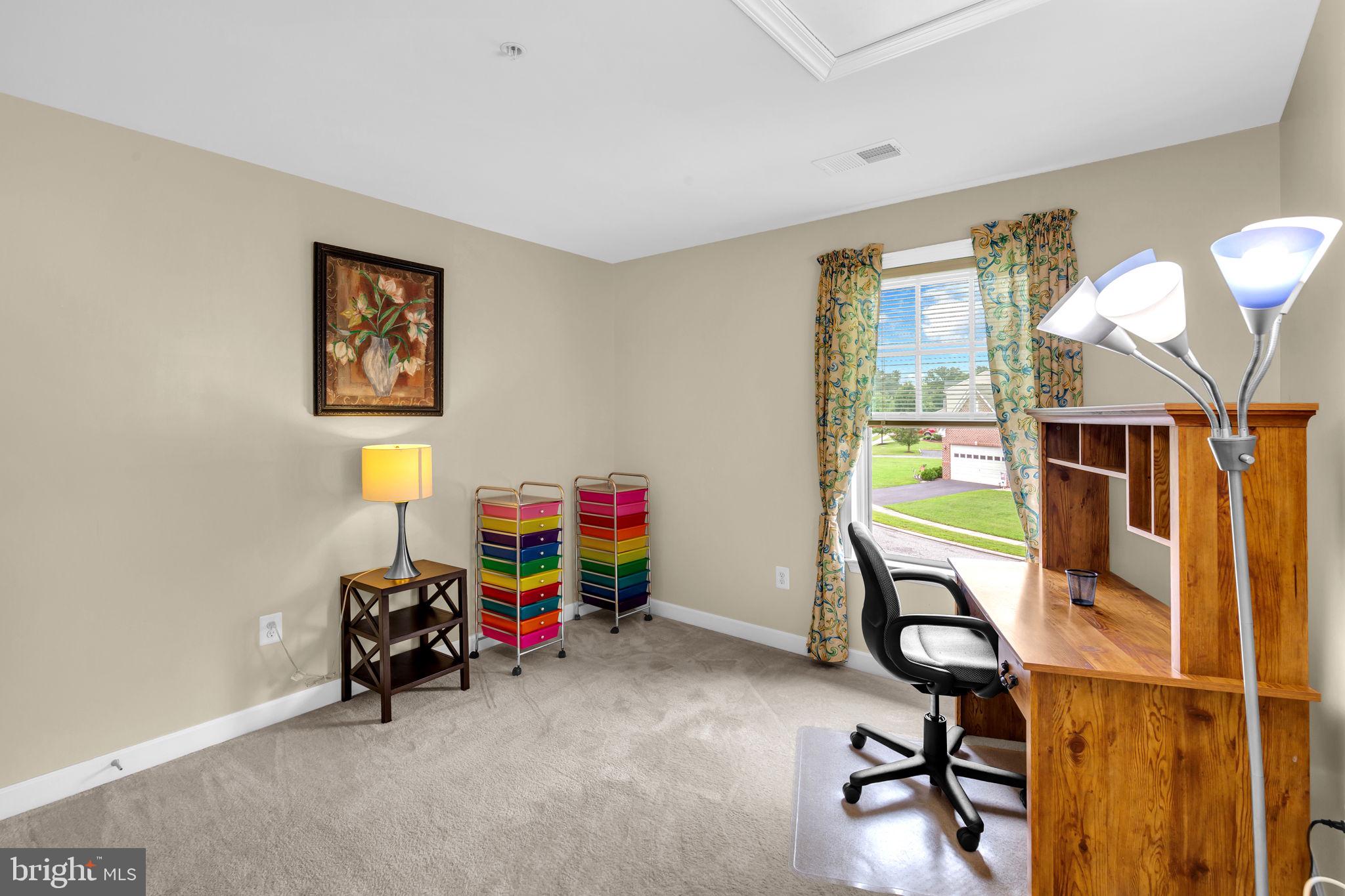 906 Gladway Road Baltimore, MD 21220 - Photo 22 of 52 a view of a workspace with furniture and a window
