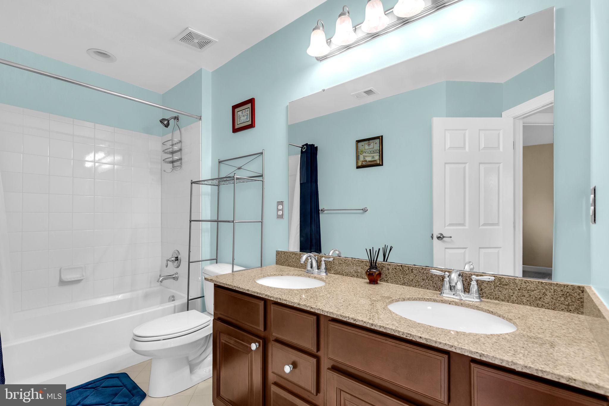 906 Gladway Road Baltimore, MD 21220 - Photo 24 of 52 a bathroom with a granite countertop sink toilet and shower