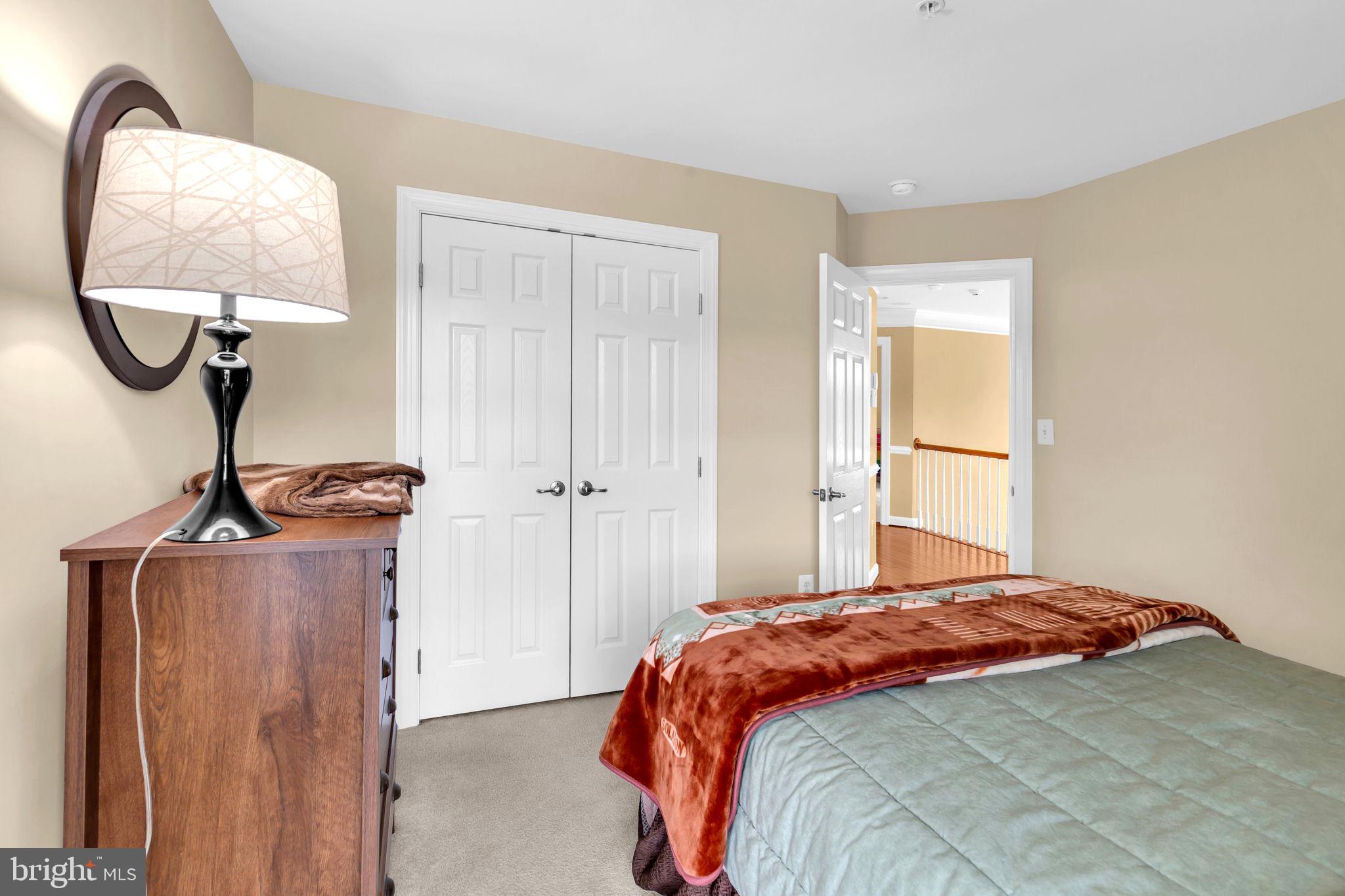 906 Gladway Road Baltimore, MD 21220 - Photo 26 of 52 a bedroom with a bed and a mirror