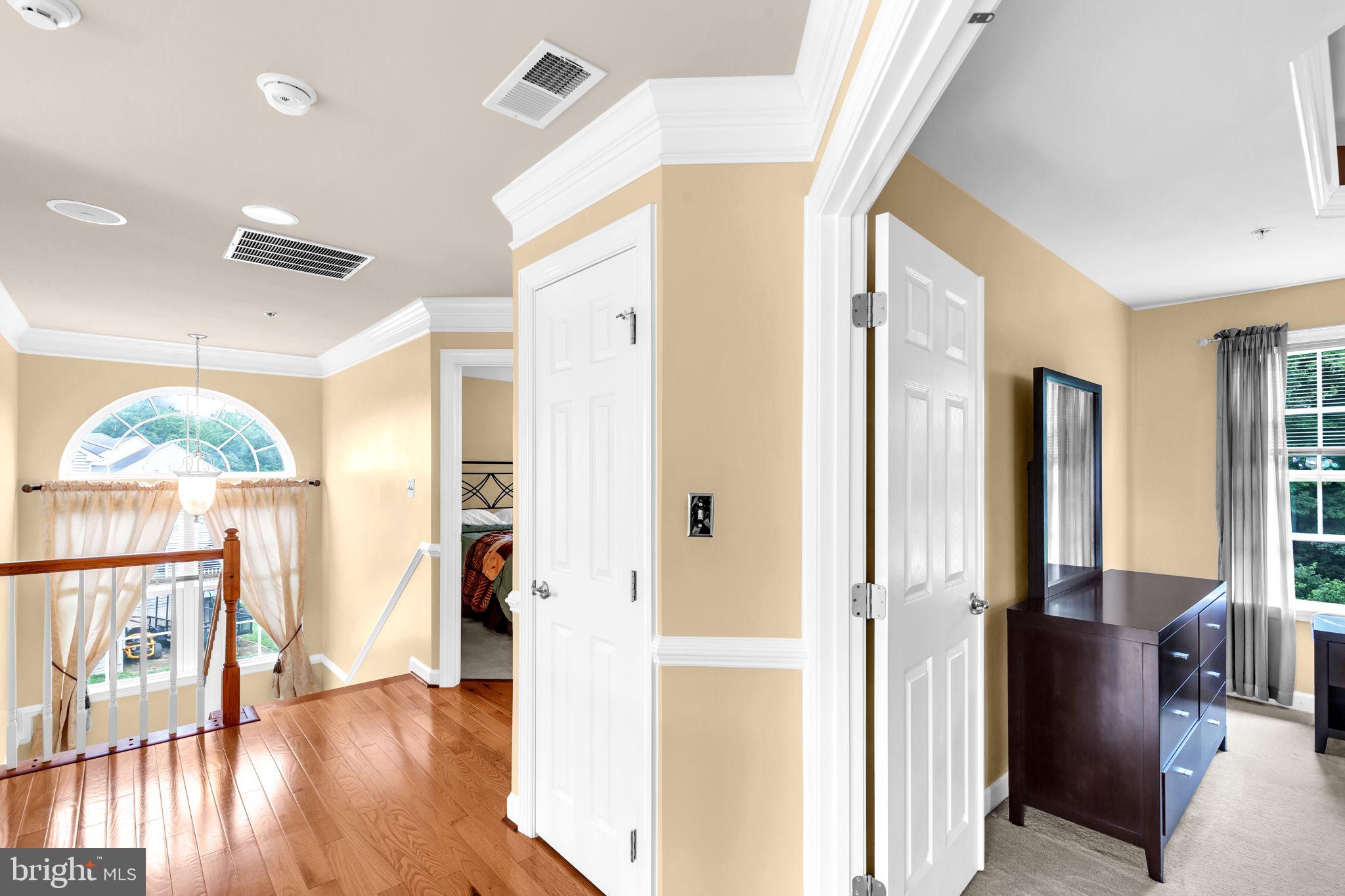 906 Gladway Road Baltimore, MD 21220 - Photo 27 of 52 a view of an entryway with wooden floor and windows