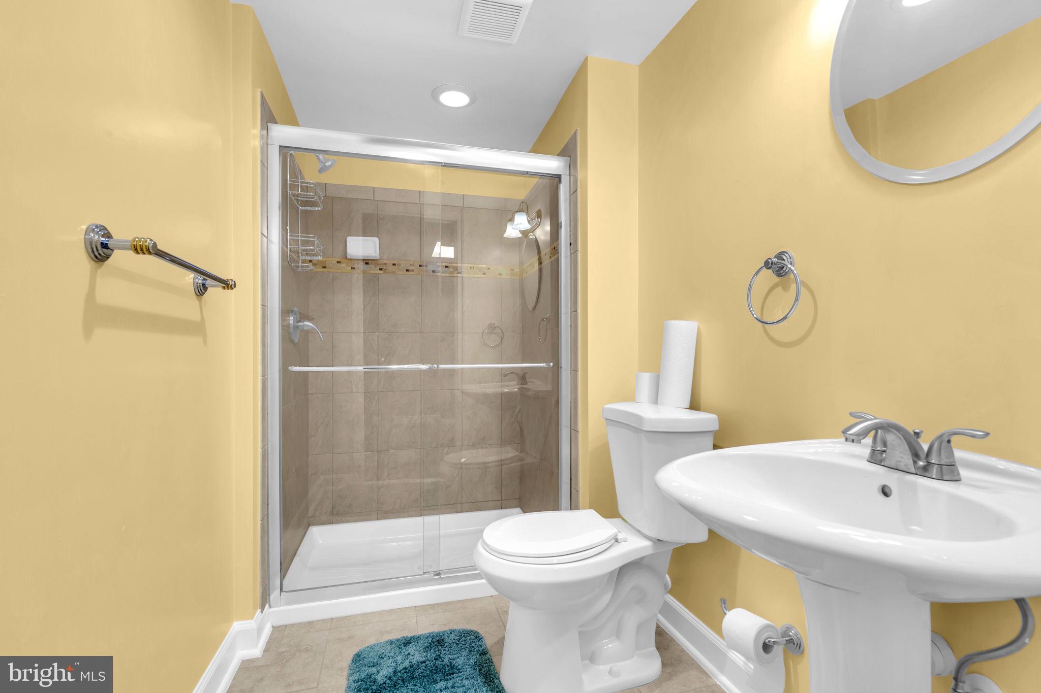 906 Gladway Road Baltimore, MD 21220 - Photo 30 of 52 a bathroom with a sink toilet and shower