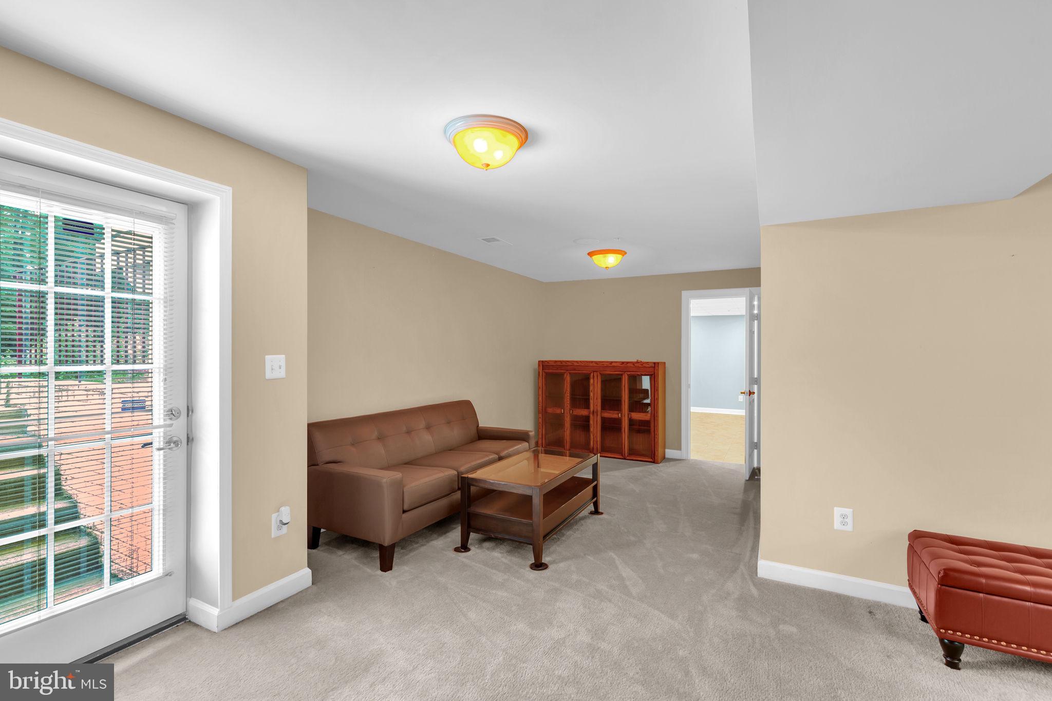 906 Gladway Road Baltimore, MD 21220 - Photo 31 of 52 a living room with furniture and a window