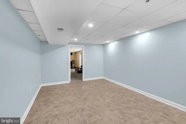 a view of a chairs on the roof deck