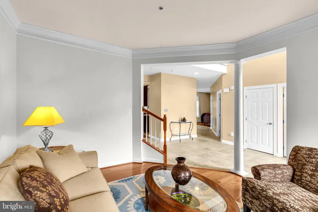 a living room with furniture and a lamp