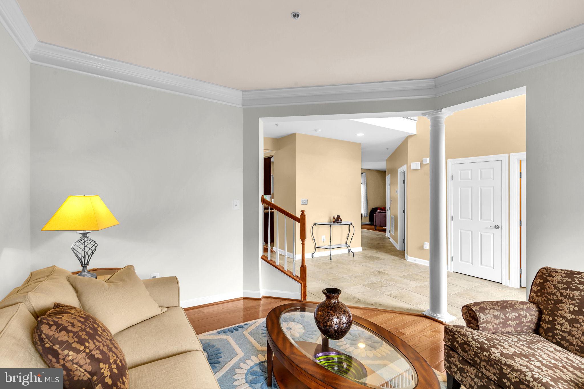 906 Gladway Road Baltimore, MD 21220 - Photo 4 of 52 a living room with furniture and a lamp