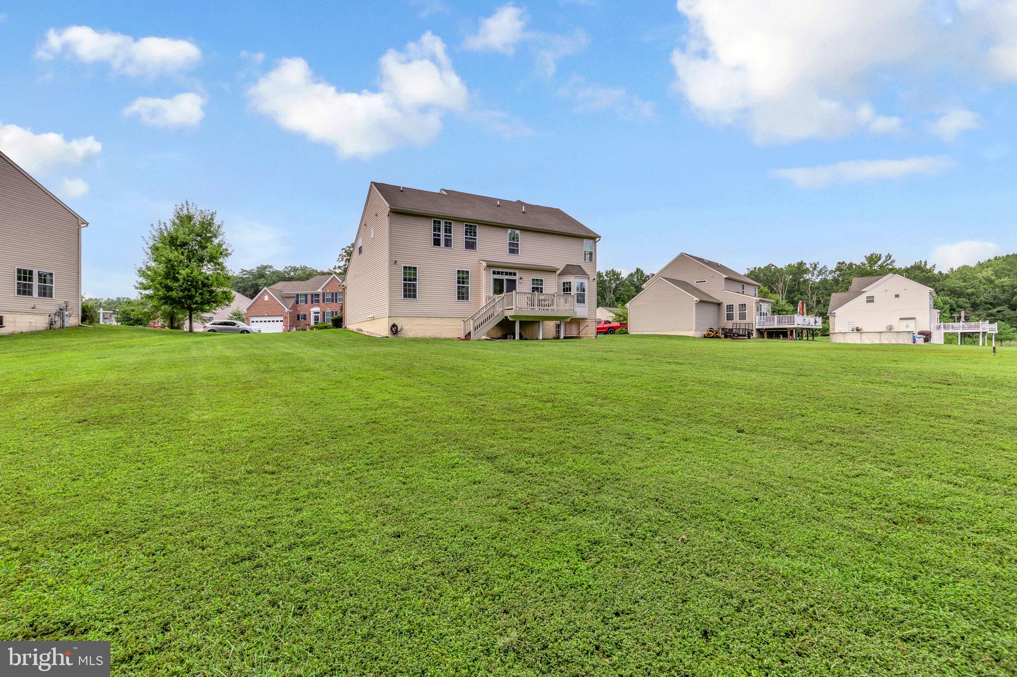 906 Gladway Road Baltimore, MD 21220 - Photo 41 of 52 a view of a house with a big yard and large trees